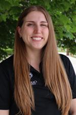 A professional headshot of Olivia R. in a black Oakland University shirt.